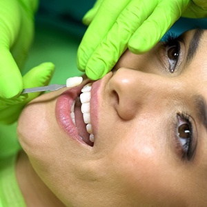 Woman having a veneer placed