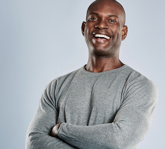 Man with a confident smile after cosmetic dental bonding in Parker