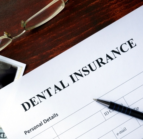 Dental insurance paperwork on desk