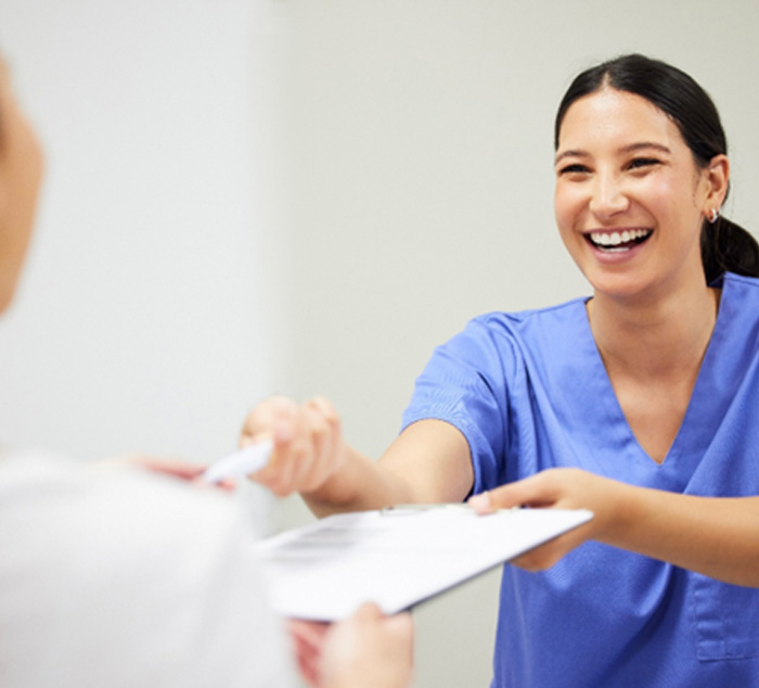 Patient in Parker smiling with dentist