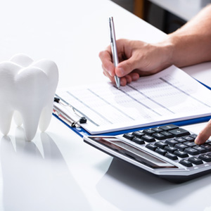 Patient in Parker going over dental insurance
