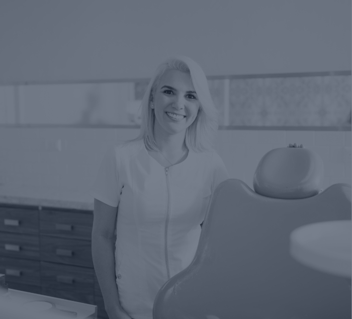 Dental team member smiling in Parker dental office