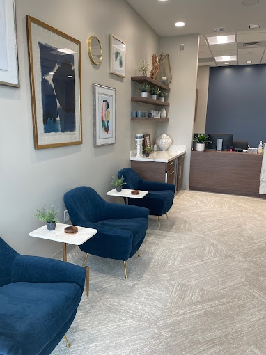 Row of blue chairs in reception area