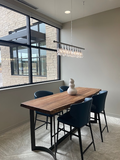 Wood table with vase near a window